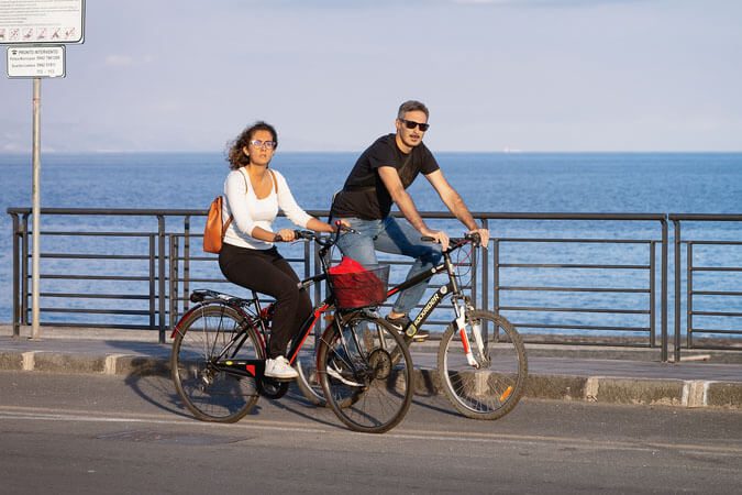 IMR Two People biking near beach